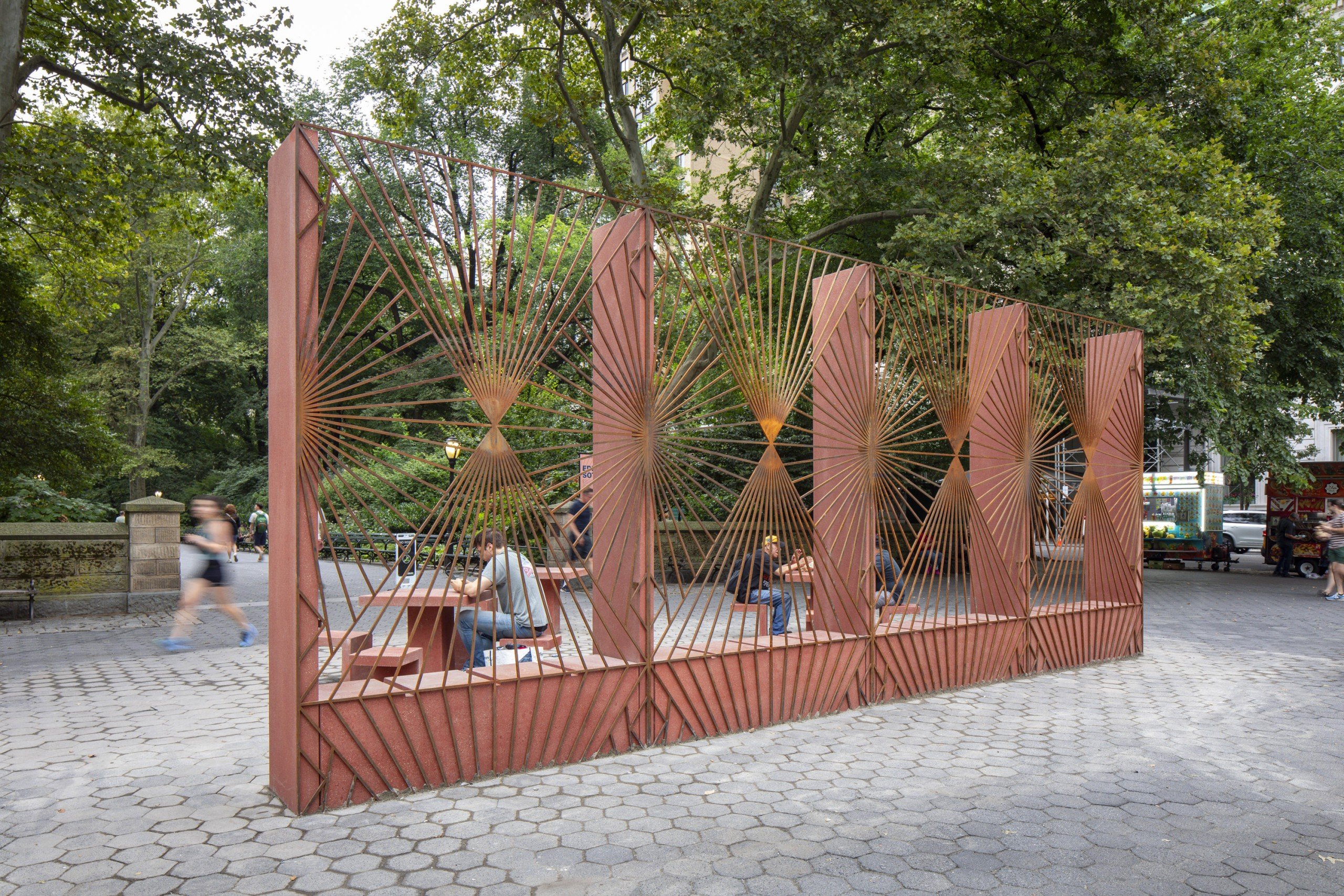 Large rectangular corten steel and terrazzo sculpture with detailed lines and patterns by Edra Soto in Central Park