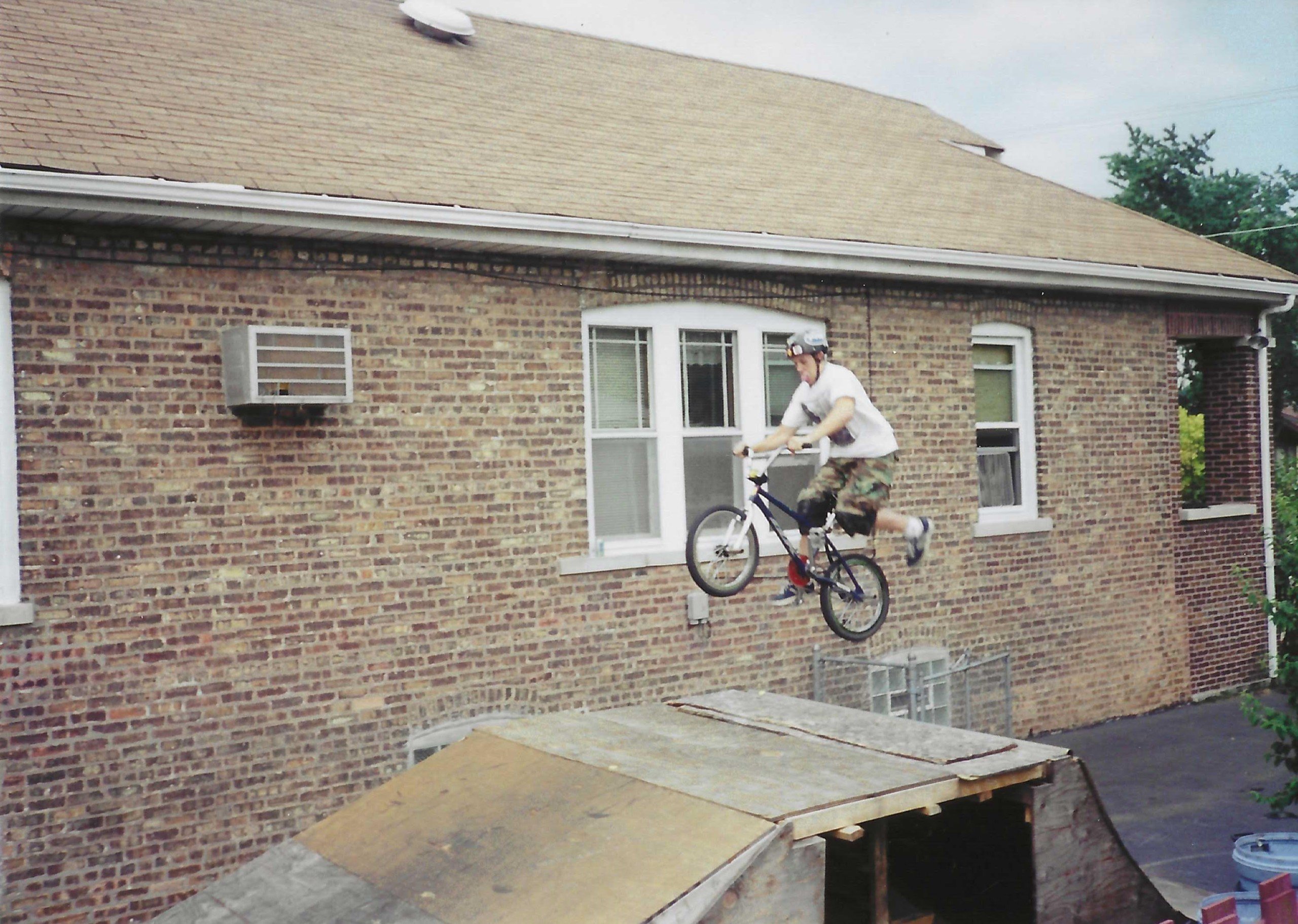 Jonathan Nesci on a bike ramp he built as a child