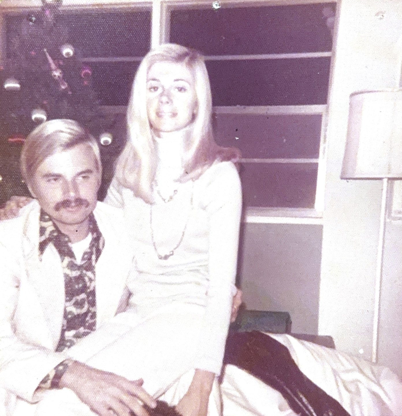 Sam Klemick's mother sitting on Klemick's father's lap in 1973