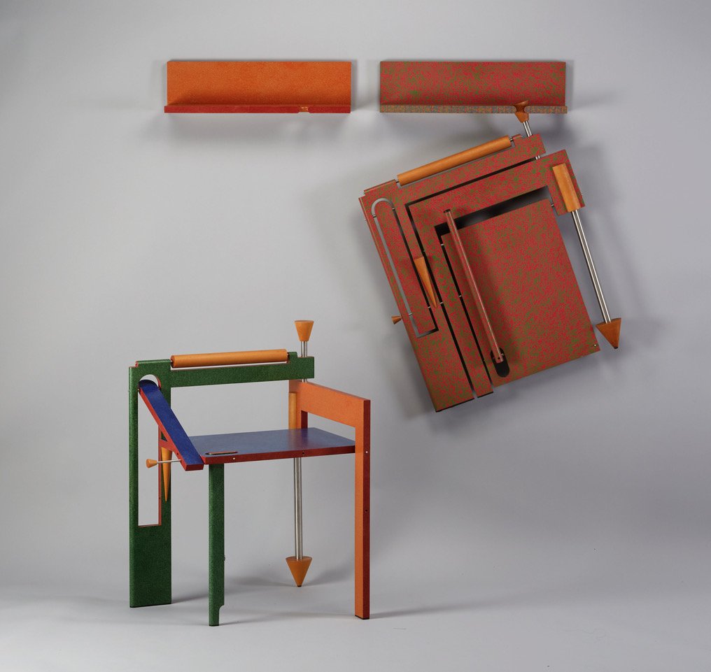 Two abstract colorful works of art resembling chairs, one on the ground, and one folded up hanging from the wall