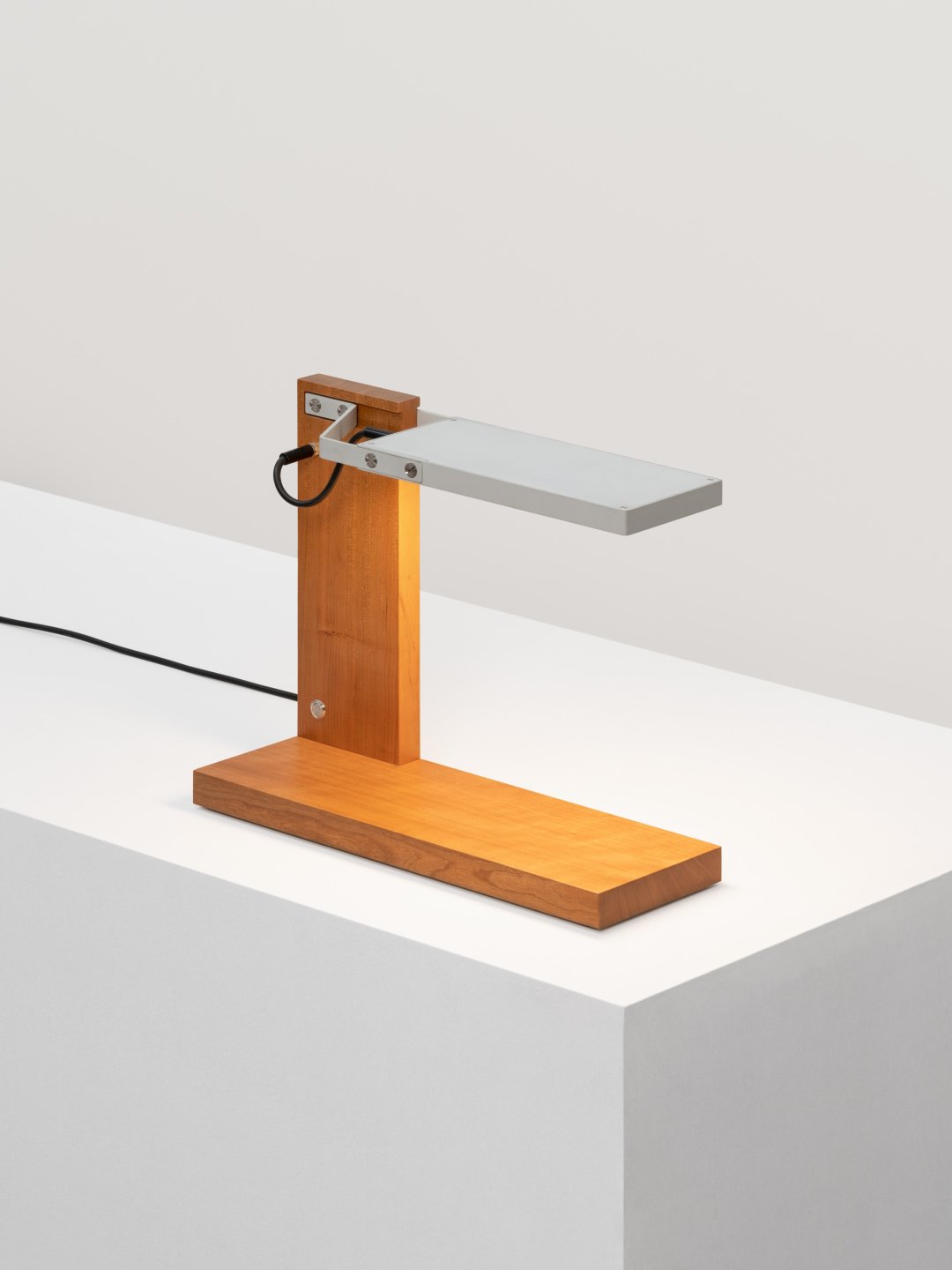 a wood and aluminum table lamp