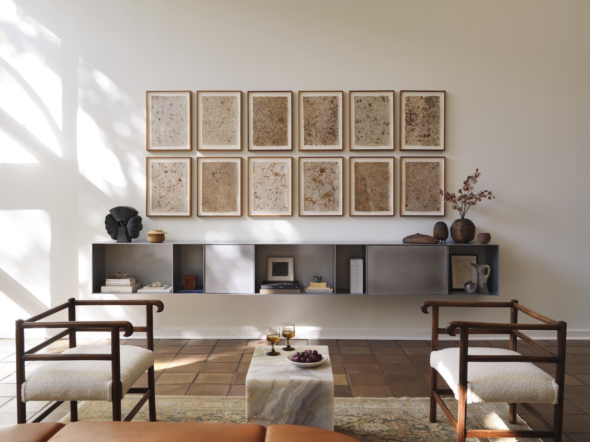 Minimalist gray shelf with several openings mounted the ewall in modern living area