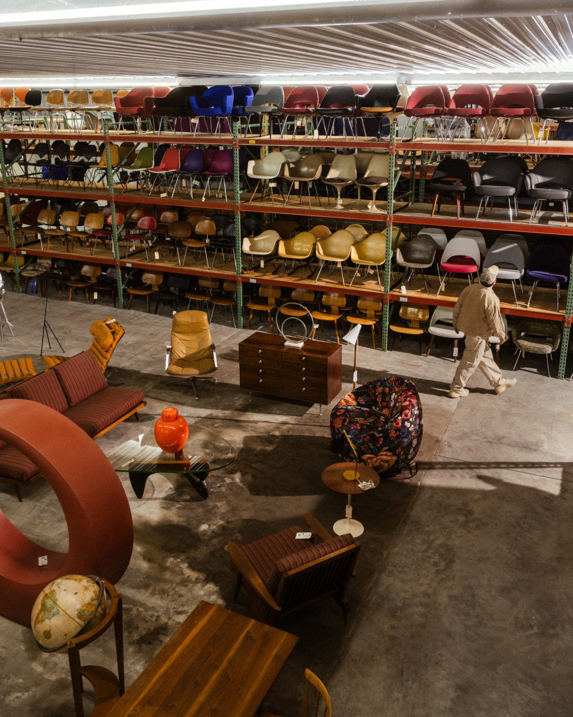 Rarify warehouse interior with shelves of colorful seating