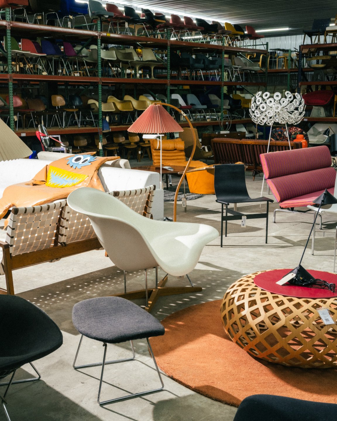Colorful vintage furniture on display on the floor of Rarify warehouse