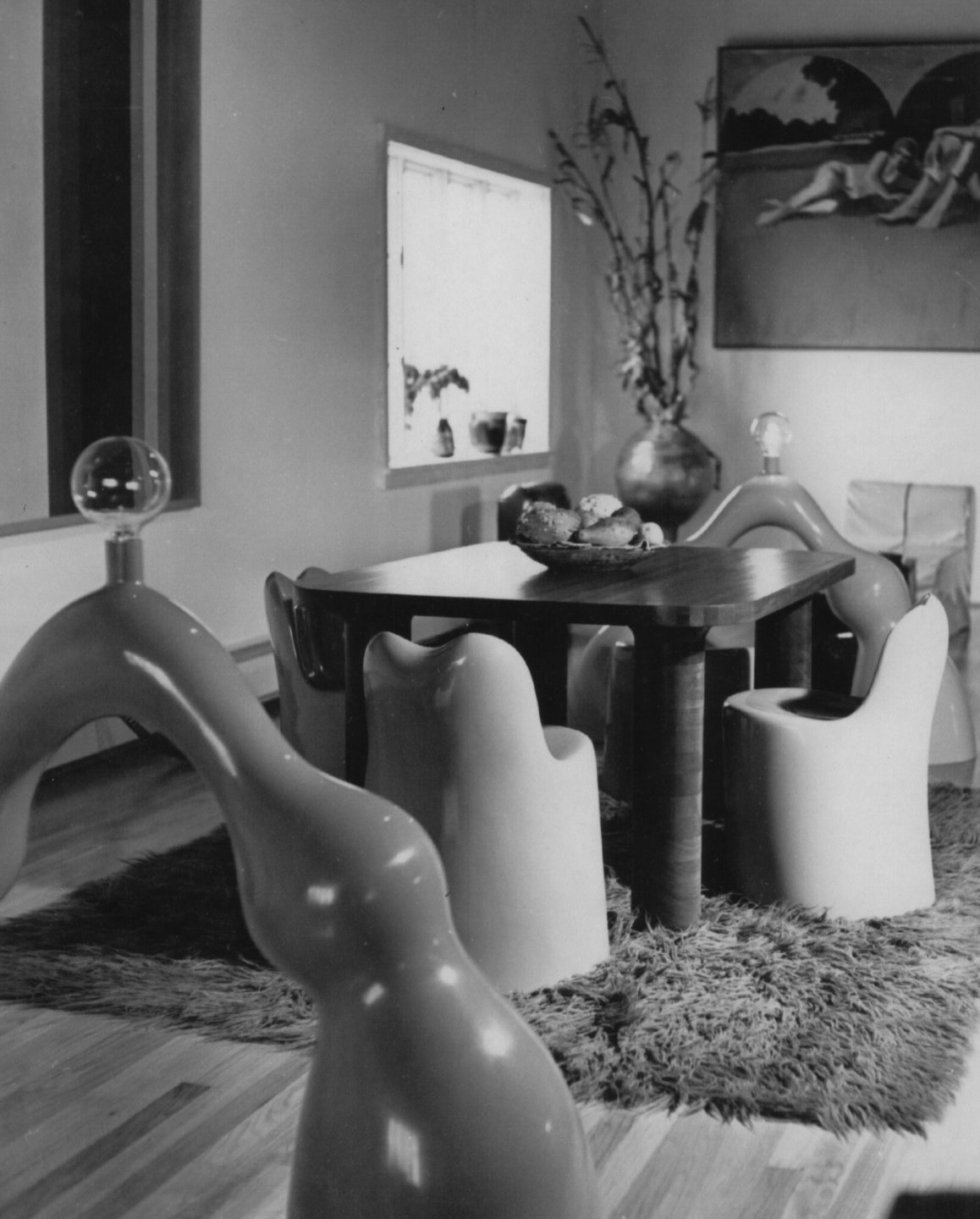 Black and white photo of Wendell Castle's dining table and chairs, in the 1970s.