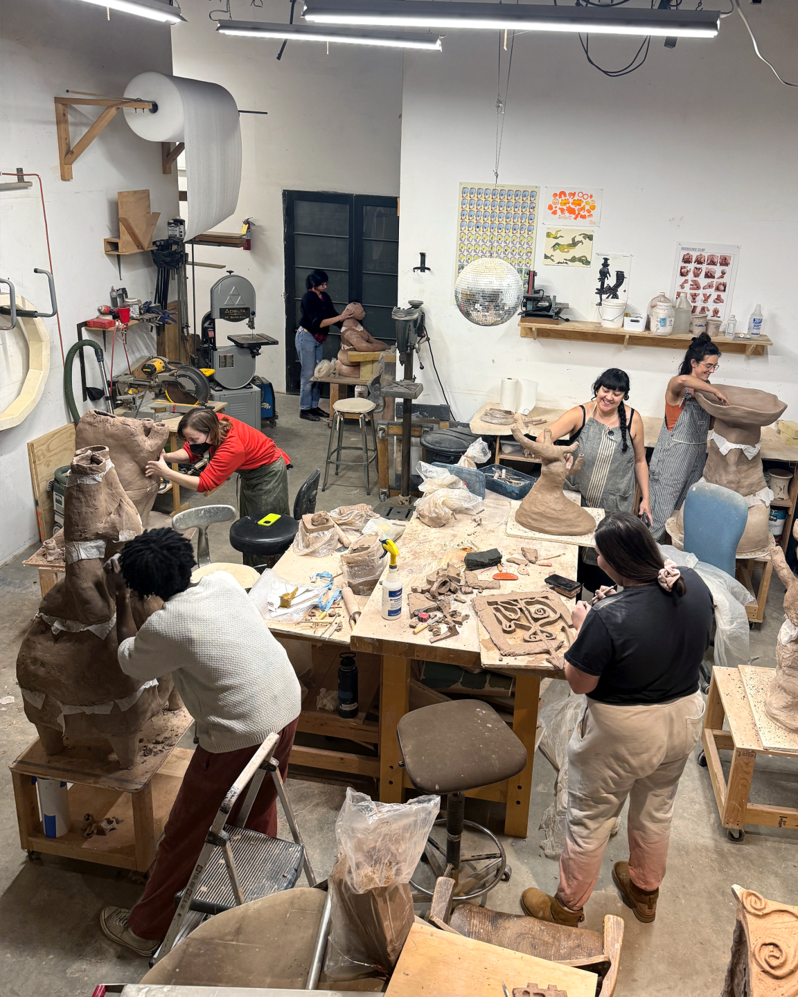People working on clay crafts inside The Infinite School